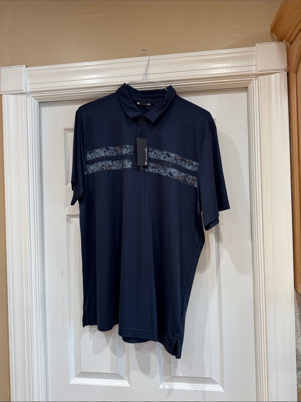 Travis Mathew Navy Polo with Patterned Chest Stripes